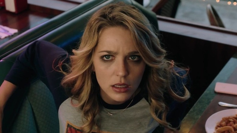 Tree Gelbman looks up from a dining booth