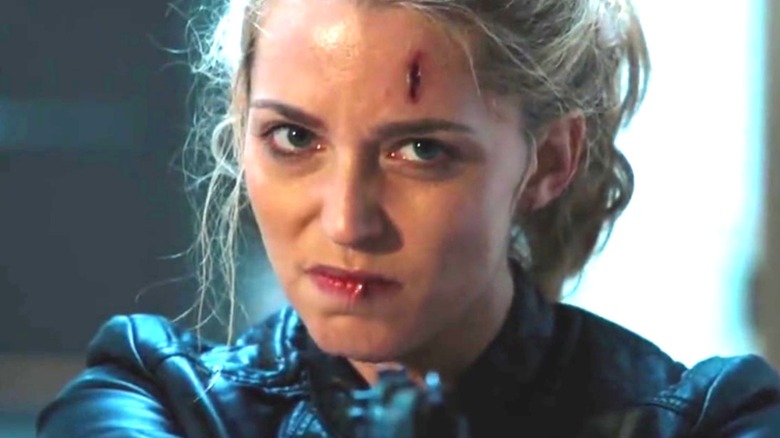 Tree Gelbman points a gun