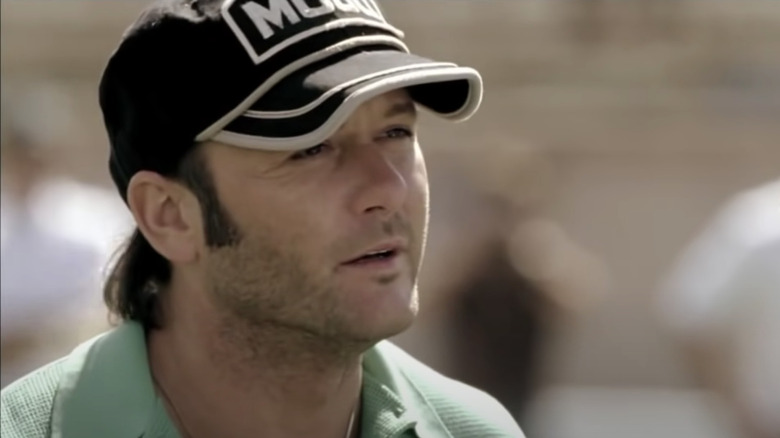 Tim McGraw wearing a hat as Charles Billingsley in Friday Night Lights