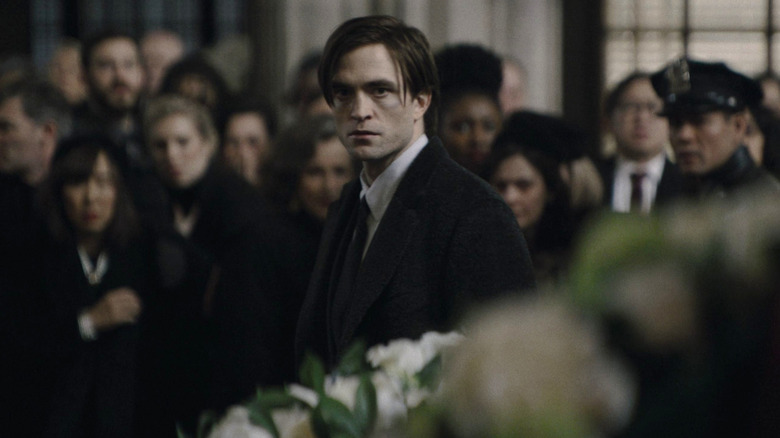 Robert Pattinson's Bruce Wayne looking worried The Batman