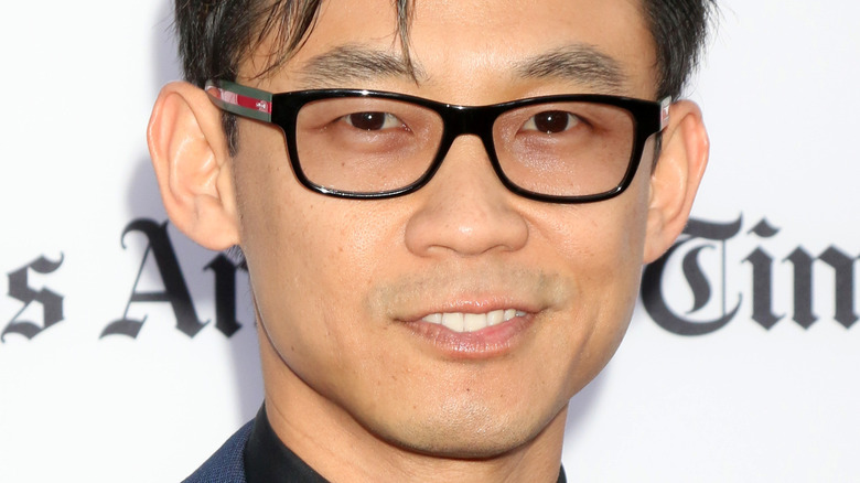 James Wan smiling against a white backdrop