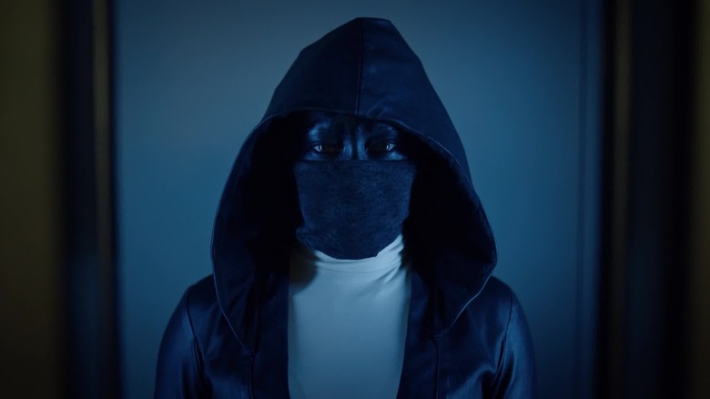 Angela Abar staring ahead