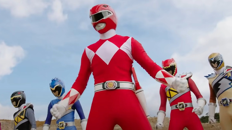 Jason the Red Ranger standing with other Rangers
