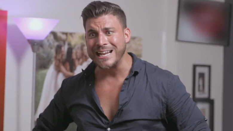 Jax screaming with his shirt mostly unbuttoned on Vanderpump Rules