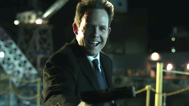 Dean Winters as Avi John Wick