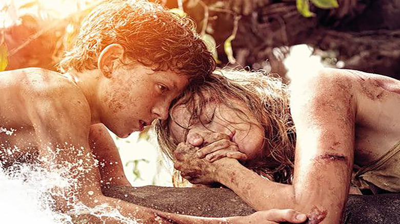 Marie and her son clutching to each other on stump