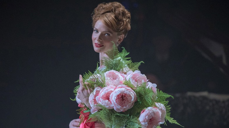 Jenny Lind smiling onstage holding flowers (2017)