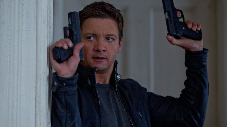 Aaron Cross with two guns in The Bourne Legacy
