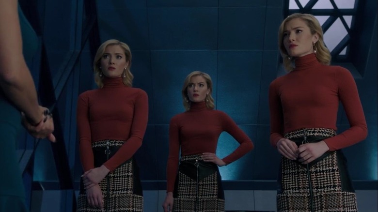 Frost sisters wearing red turtlenecks