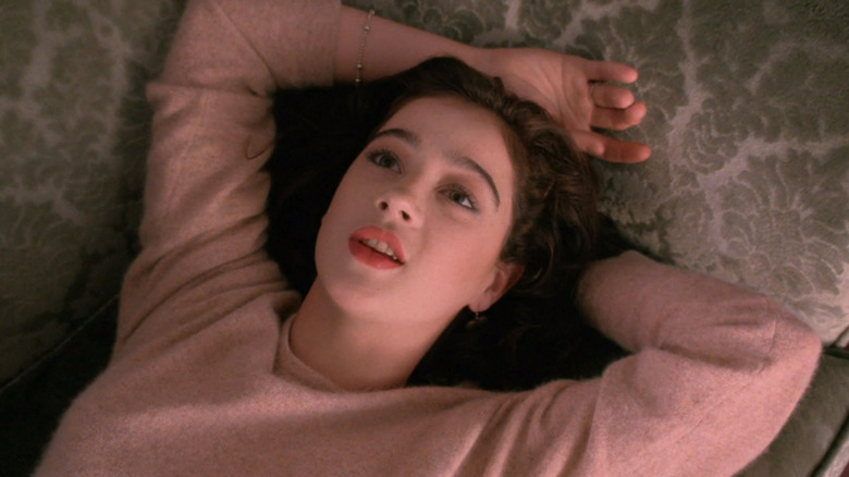 Donna Hayward sprawling on couch