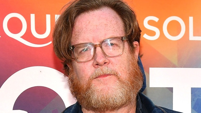 Steve Agee in front of orange backdrop