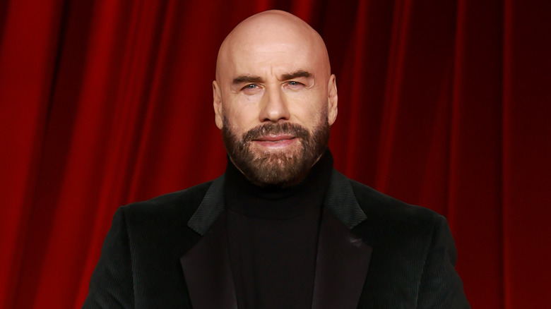 John Travolta posing in black