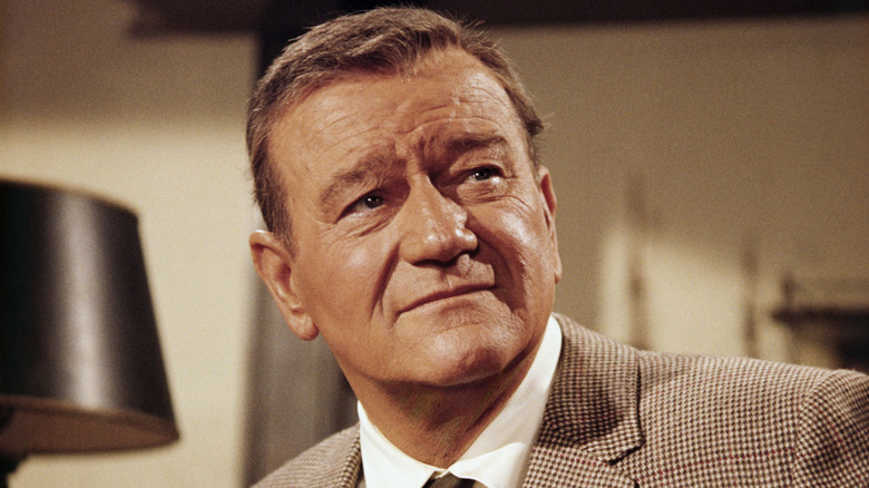John Wayne wearing a suit