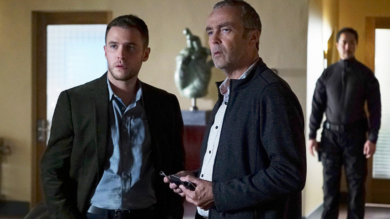Agent Leo Fitz and Holden Radcliffe standing