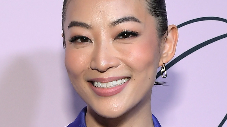 Arden Cho smiling at a promotional event for Partner Track