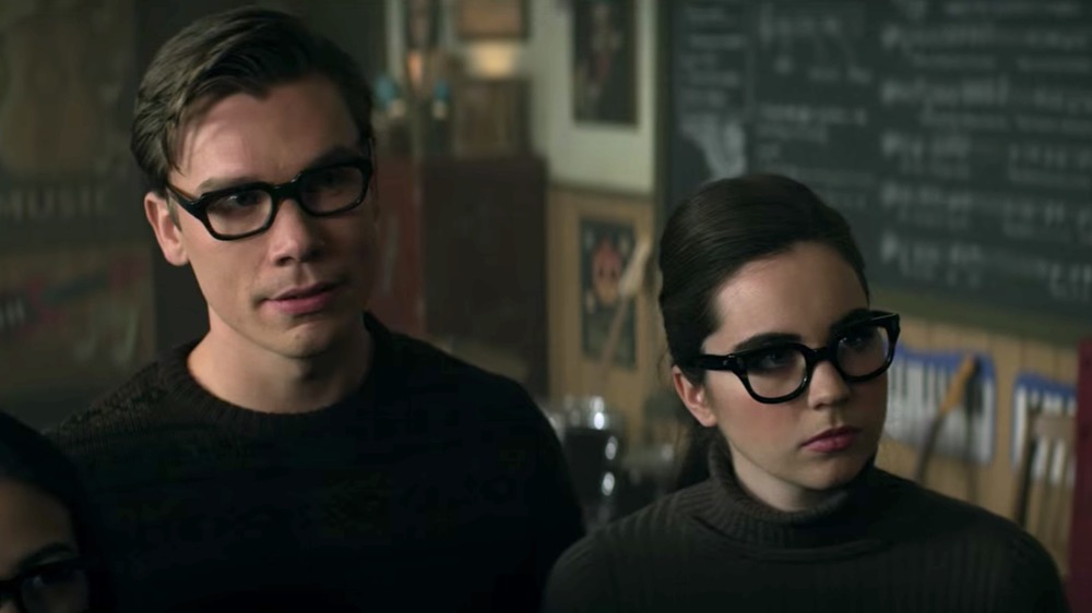 Sarah Desjardins as Katie looking intimidating in glasses