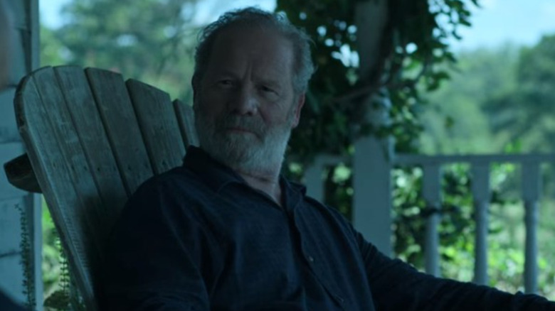 Mullan sitting in a chair, looking calm