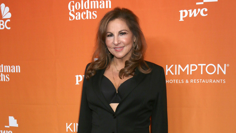 Kathy Najimy posing at a premier 