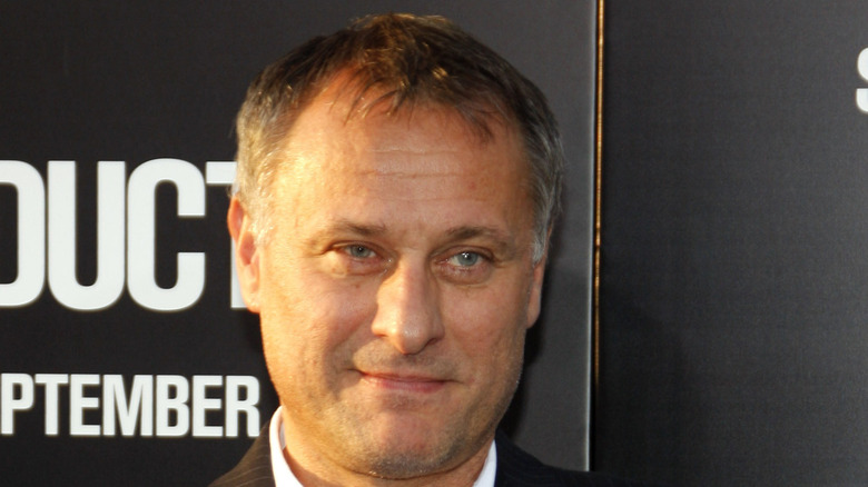 Michael Nyqvist posing at premiere