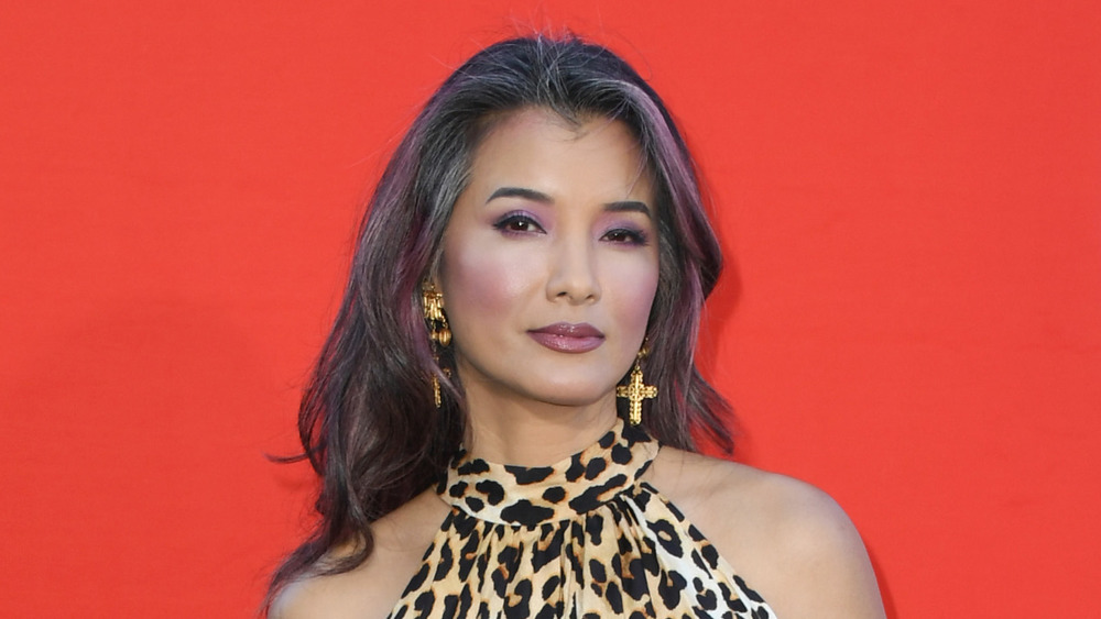 Kelly Hu in a leopard print dress