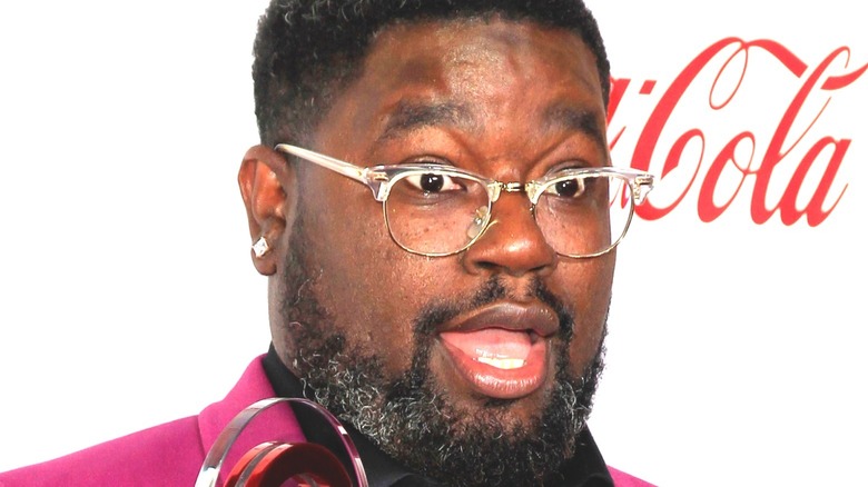 Lil Rel Howery poses at event 