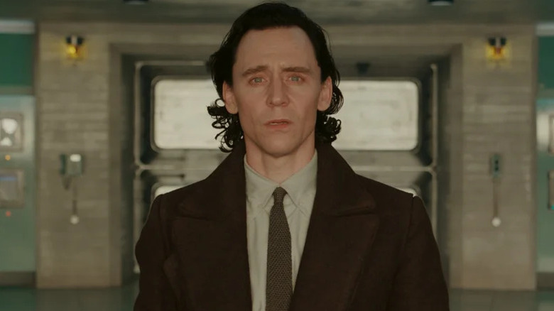 Loki wearing a tie and looking concerned on Loki