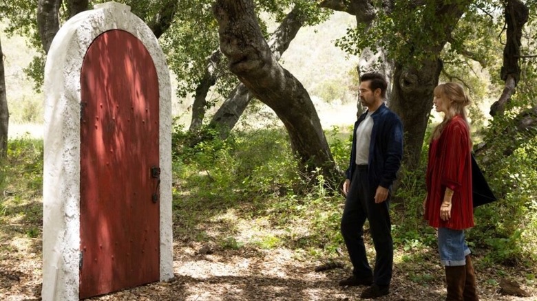 David and Sarah staring at an ominous door in A Big Bold Beautiful Journey (2025)