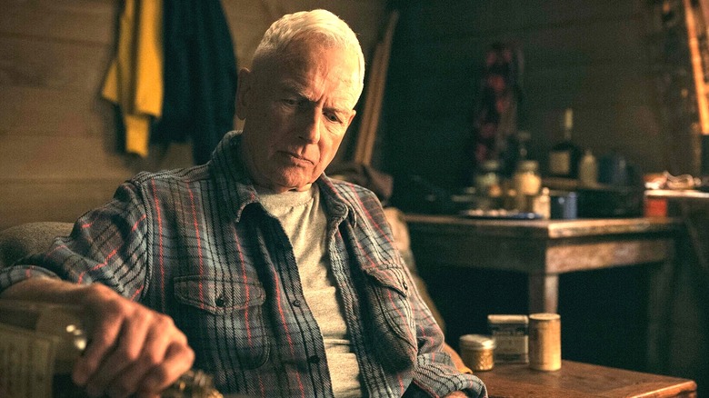 Leroy Jethro Gibbs pouring a drink in