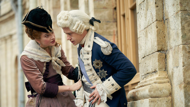 Maria Feodorovna comforting a man