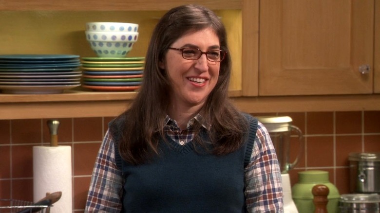 Amy Farrah Fowler smiling to the right