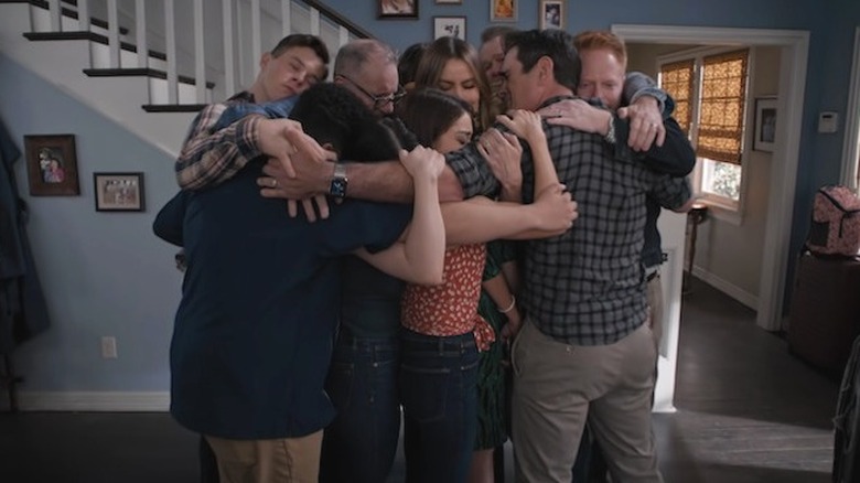 The cast of Modern Family in a group hug