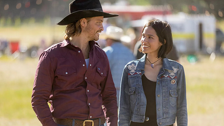 Kayce and Monica smile at each other in "Yellowstone"