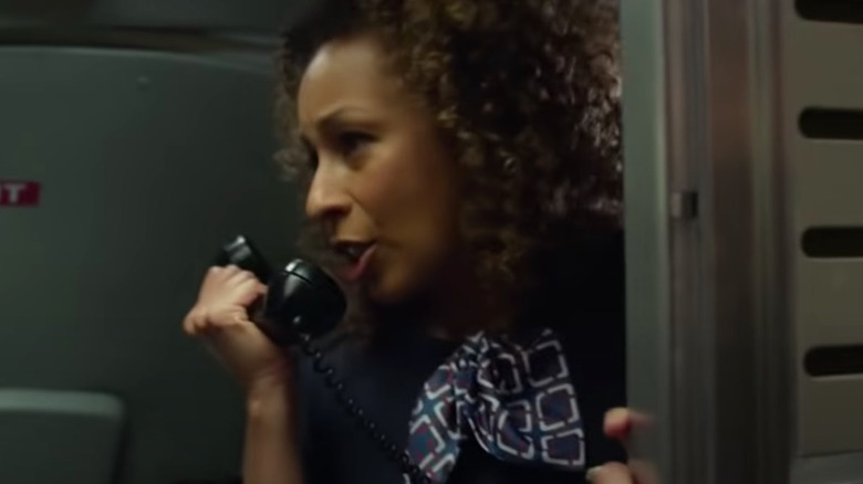 Margaret on phone in Flight