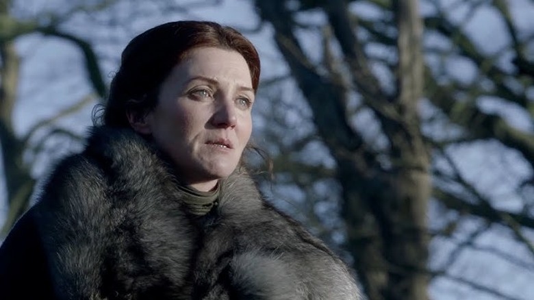 Catelyn surrounded by trees