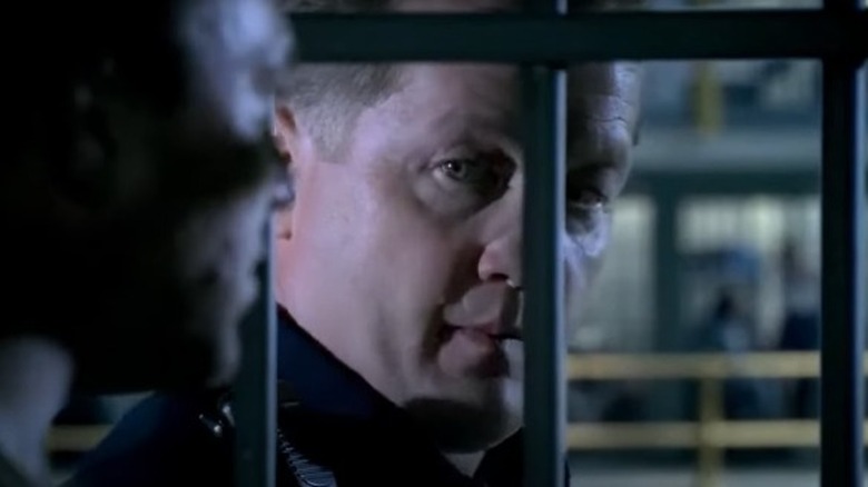 Keith Stolte looking through prison bars