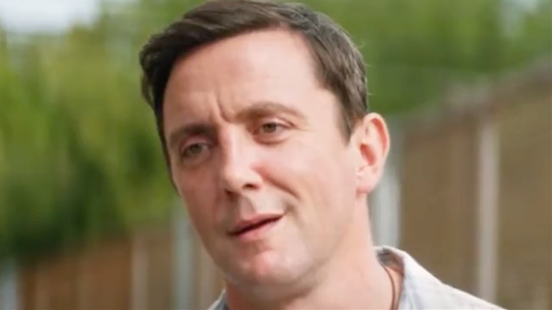 Peter Serafinowicz smirking in Going in Style