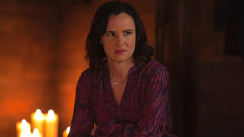 Natalie listening among candles in "Yellowjackets"