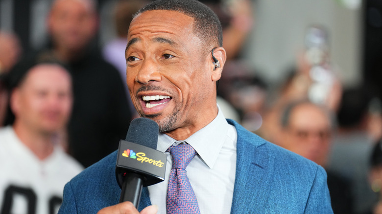 Rodney Harrison talking on an NBC Sports microphone