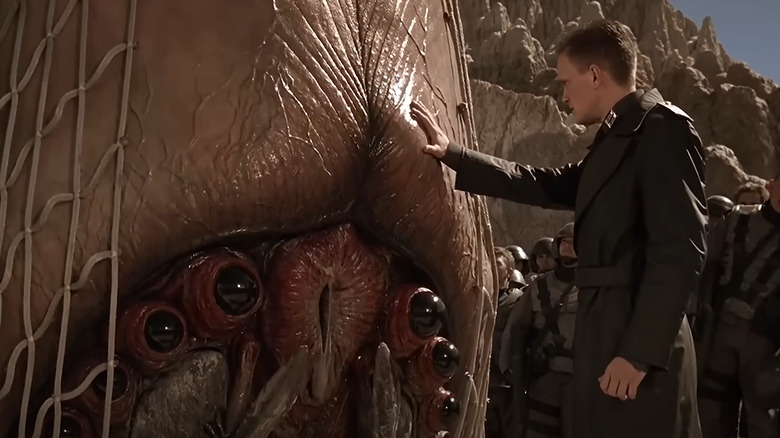 Carl touches the bug
