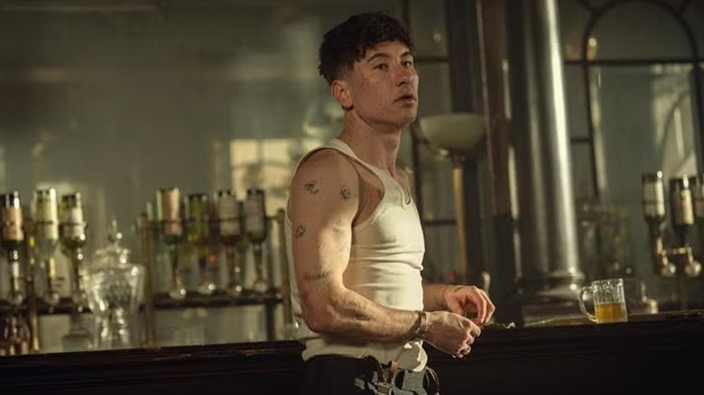 Duke Shelby stands before a bar in "Peaky Blinders: The Immortal Man"