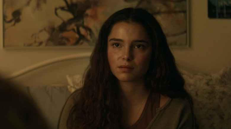 Sarah Cortez sitting on a couch in Superman & Lois