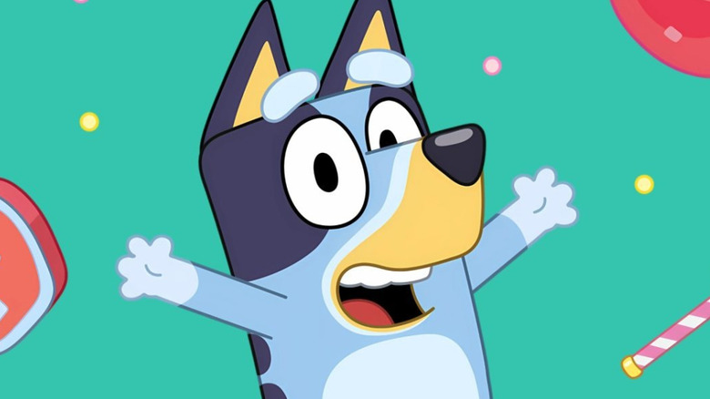 Bluey raises her arms