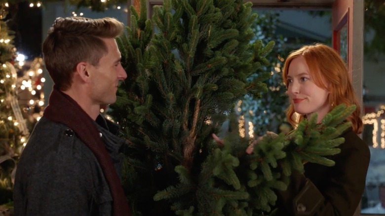 Alicia Witt with a pine tree