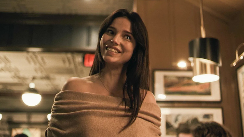 Nikki breaks down in the restaurant in "Obsession" (2026)