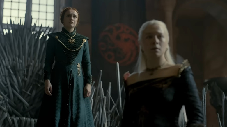 Alicent Hightower stands in front of the Iron Throne