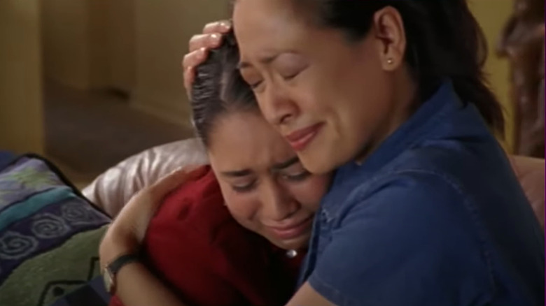 Manny's mom holding her