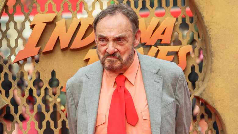 John Rhys-Davies smirking