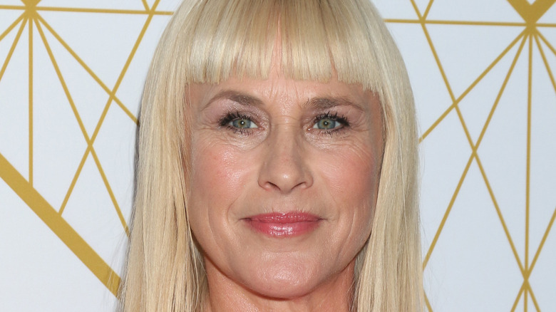 Patricia Arquette with bangs and wearing lipstick