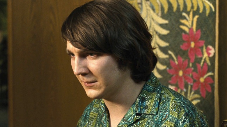 Brian Wilson sits in patterned shirt 
