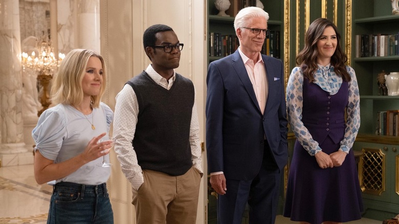 Eleanor, Chidi, Michael, and Janet smiling